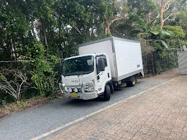 Merlin, the Junk Removers empty enclosed Isuzu pantech truck in Coffs Harbour
